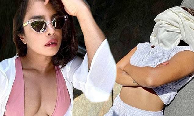 Priyanka Chopra flashes the flesh in plunging swimsuit for 'Expectation vs. Reality' album - dailymail.co.uk