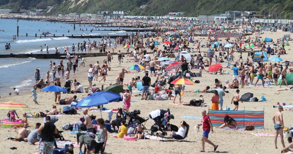 Boris Johnson - Brits flock to packed beaches on scorching Bank Holiday Monday despite lockdown - dailystar.co.uk