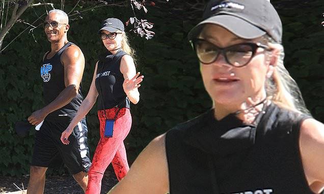 Melanie Griffith - Melanie Griffith steps out in 'Love First' tank top and red leggings in Beverly Hills amid pandemic - dailymail.co.uk - state California - county Hill - city Beverly Hills, state California