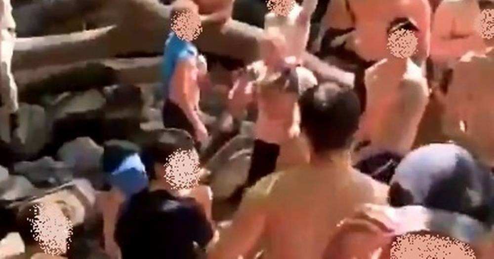 Hundreds of topless youths surrounded by knickers and bottles at waterfall 'rave' - mirror.co.uk - Britain