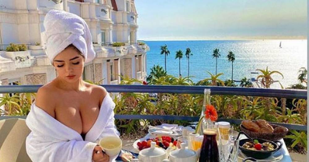 Demi Rose struggles to contain boobs as bathrobe gapes open in red-hot display - dailystar.co.uk - Britain