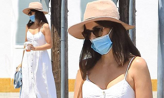 Camilla Belle cuts a chic figure in a stylish white summer dress as she covers up in a face mask - dailymail.co.uk - Los Angeles - city Los Angeles
