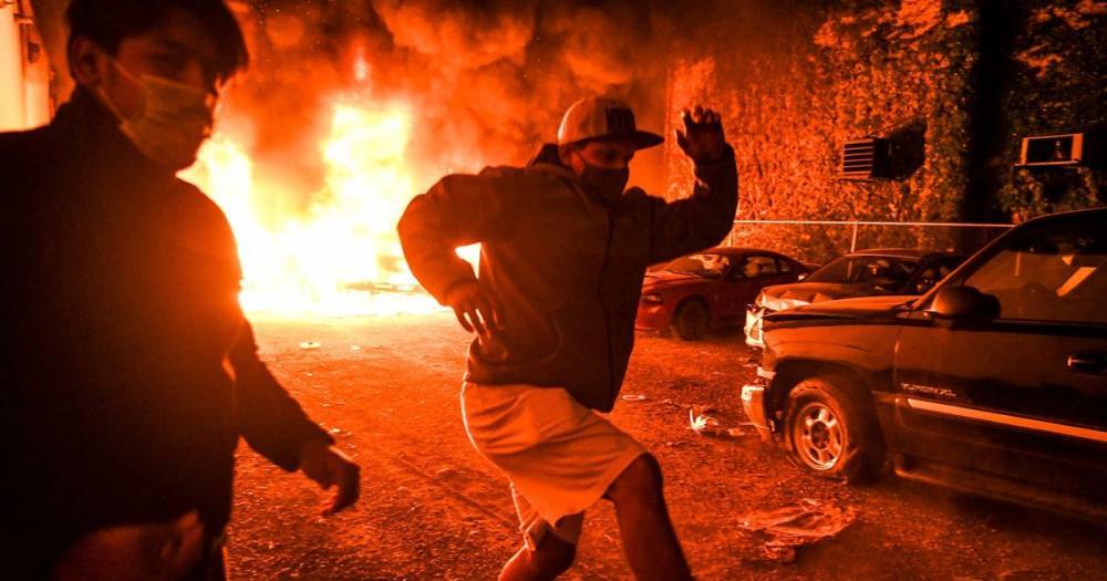George Floyd - Derek Chauvin - George Floyd protests: Fires burn across US and policeman shot dead in clashes - mirror.co.uk - Usa - state California - state Minnesota - county George - city Minneapolis - county Oakland - county Floyd