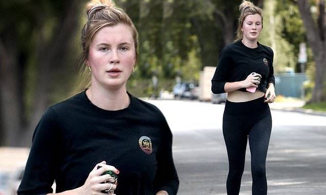 Ireland Baldwin teases her taut midriff in black as she jogs with friend in LA during quarantine - dailymail.co.uk - Ireland - Los Angeles - city Los Angeles