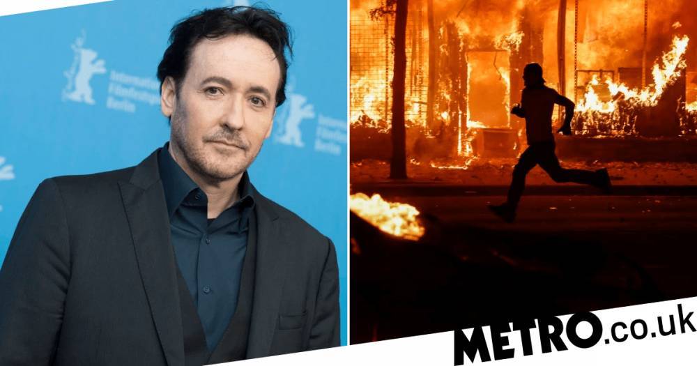 John Cusack - George Floyd - John Cusack ‘attacked by Chicago police’ filming burning car during riots as protesters city set ablaze - metro.co.uk - state Illinois - city Chicago