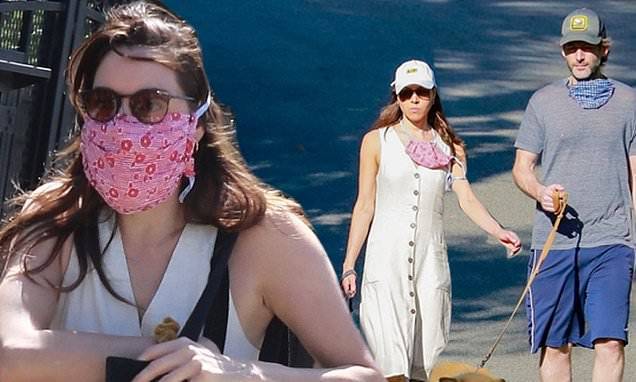 Aubrey Plaza braves the open air with longtime boyfriend Jeff Baena as they walk their dogs - dailymail.co.uk