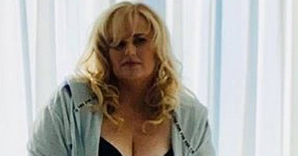 Rebel Wilson flaunts weight loss and killer cleavage as she strips down to bra - dailystar.co.uk - Australia