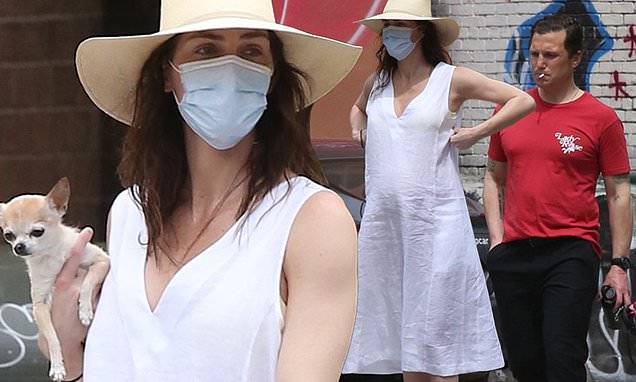 Hilary Rhoda shows off baby bump in white dress while walking dogs in NYC with husband Sean Avery - dailymail.co.uk - city New York