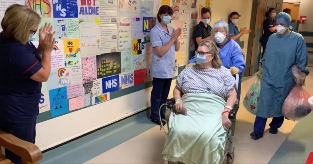 Touching moment ward clerk in recovery from coronavirus is applauded by 'overjoyed' colleagues as she leaves the critical care unit - manchestereveningnews.co.uk