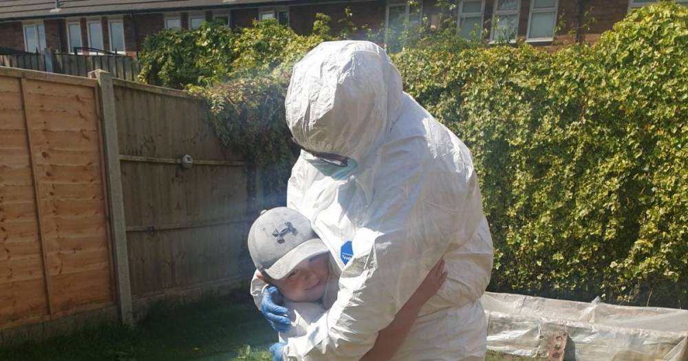 Key worker desperate to hug crying grandson, 6, dresses in full hazmat suit - mirror.co.uk
