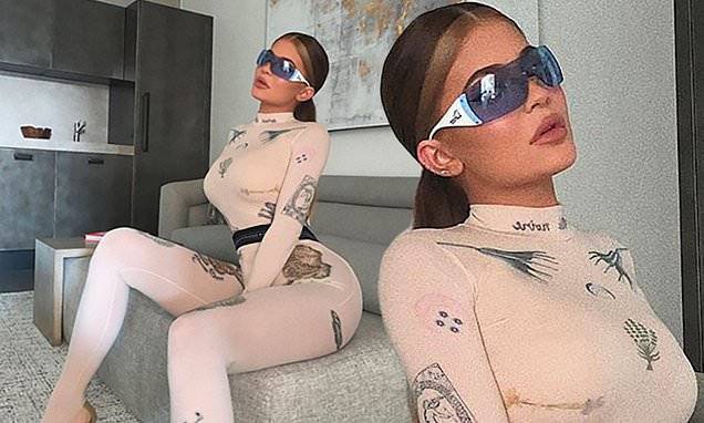 Kylie Jenner - Kylie Jenner flaunts her hourglass figure in an unforgiving pink catsuit - dailymail.co.uk