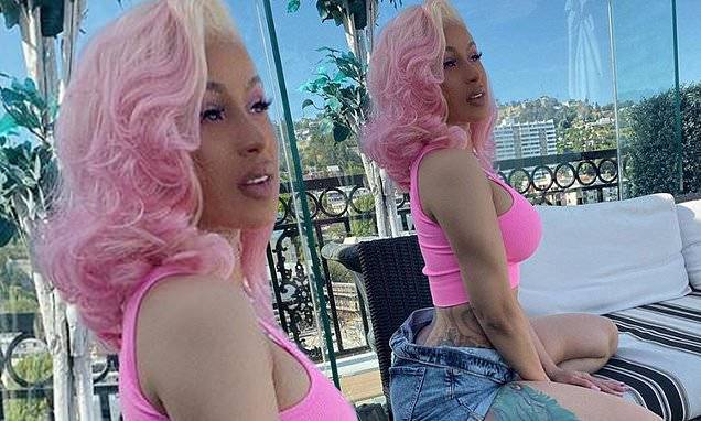 Cardi B shows off her knockout legs in short shorts as she poses for pinup shot - dailymail.co.uk