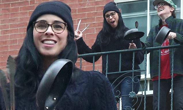 Sarah Silverman bundles up as she shows support for essential workers during daily salute in NYC - dailymail.co.uk - city New York