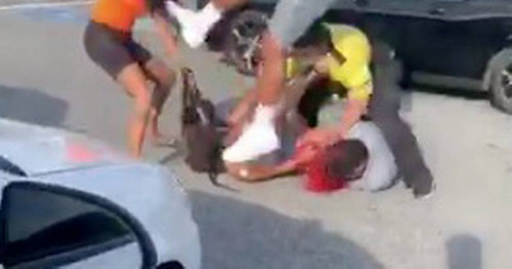 Man fly-kicks woman in brawl that spills from mall into car park in sickening video - dailystar.co.uk - Usa - city Atlanta - Georgia
