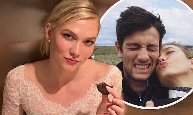 Karlie Kloss eats a cookie on the floor in her wedding dress - dailymail.co.uk