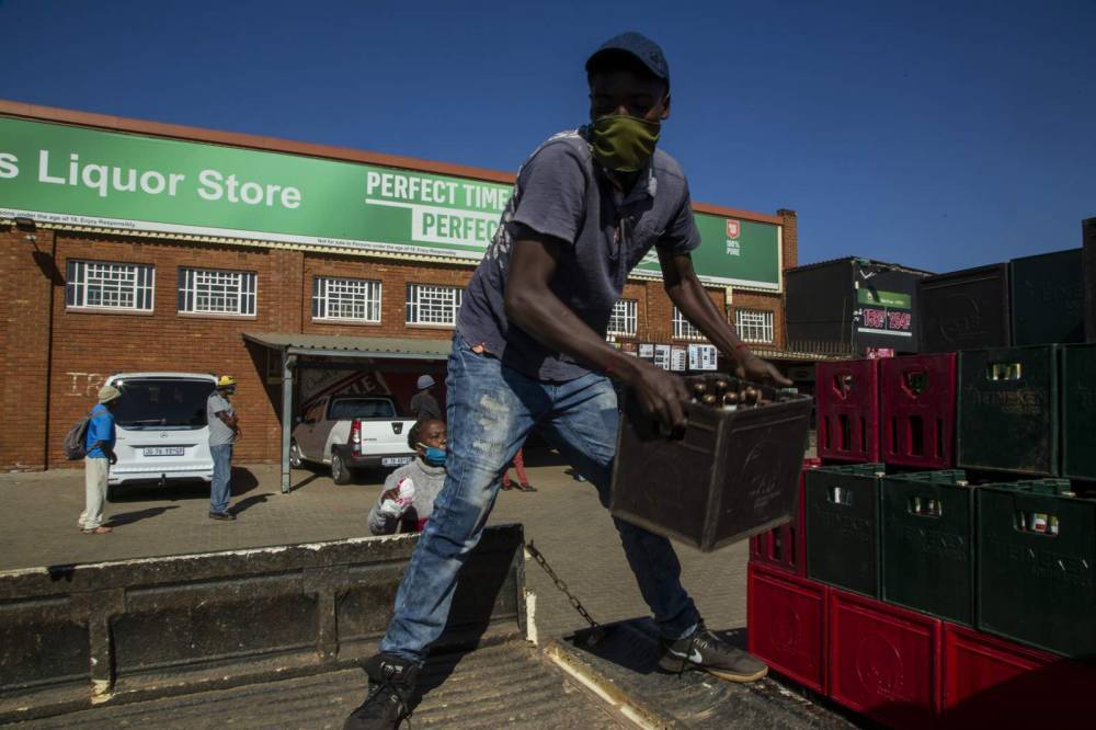 South Africa eases; liquor is sold, school openings delayed - clickorlando.com - South Africa - city Cape Town