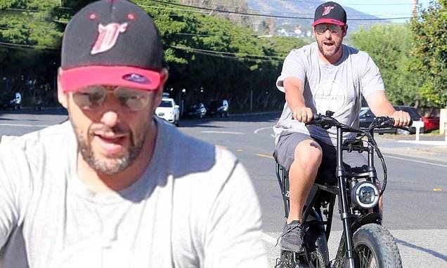 Adam Sandler - Adam Sandler enjoys bike ride in sunny Malibu as he continues to self-isolate at home with family - dailymail.co.uk - city Malibu - city Sandler