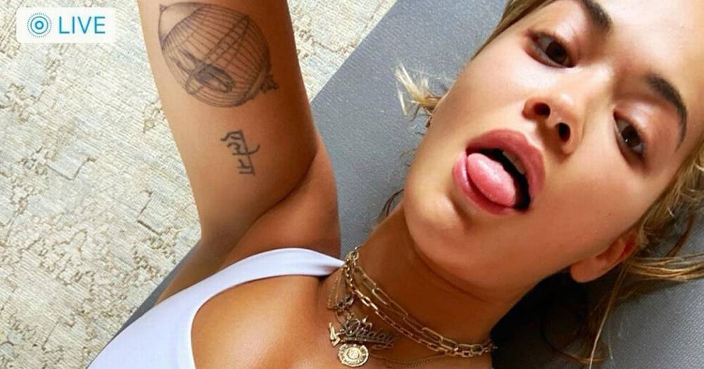 Rita Ora - Rita Ora deletes cleavage-exposing snap after fans spot epic Photoshop fail - dailystar.co.uk