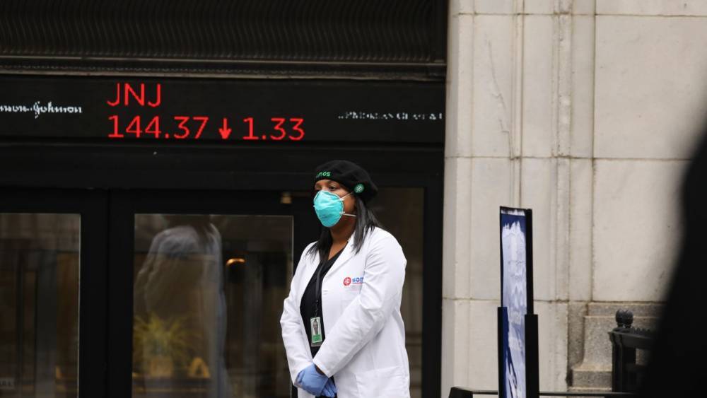 Dow sinks 1,800 as virus cases rise, deflating optimism - fox29.com - New York
