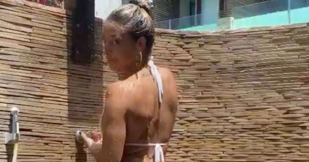 Weather girl beauty sends temperatures soaring in tiny bikini for outdoor shower - dailystar.co.uk - Argentina