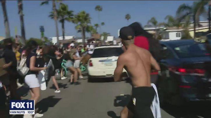 Car careens through crowd of peaceful protesters in Newport Beach; driver in custody - fox29.com - state Arizona - county Newport - county Cooper