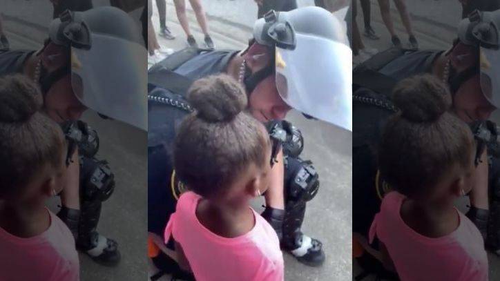 George Floyd - Police officer comforts crying little girl who asked 'are you gonna shoot us?' during protest - fox29.com - state Texas - Houston, state Texas