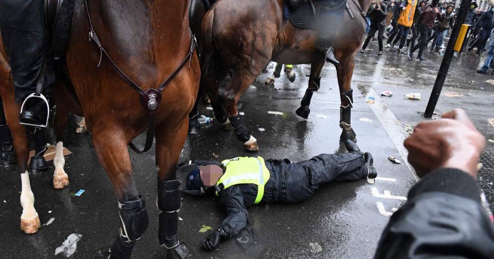 London protests: Moment police officer thrown off horse after riding into traffic light - dailystar.co.uk - Usa - county George - county Floyd - city Minneapolis, county Floyd