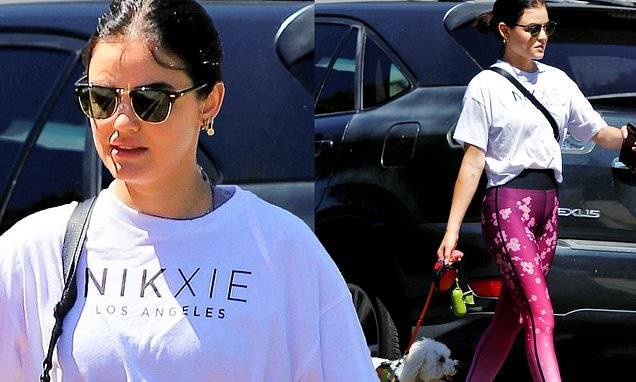 Lucy Hale - Lucy Hale showcases her petite figure in purple-patterned leggings during a walk with her dog Elvis - dailymail.co.uk - Los Angeles - state California - city Los Angeles