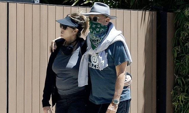 Tom Hanks - Rita Wilson - Tom Hanks covers his face with a bandanna as he takes a Sunday afternoon stroll with Rita Wilson - dailymail.co.uk - county Pacific - state California