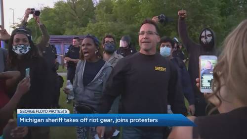 Why some police march in solidarity with protesters - globalnews.ca - state Michigan