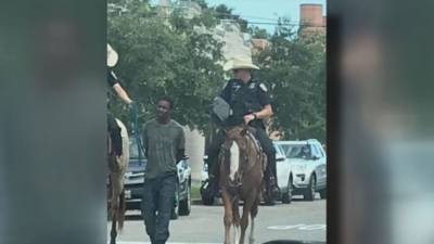 Black man sues Texas city for $1M after viral photo showed mounted officers leading him by rope - fox29.com - state Texas - county Galveston