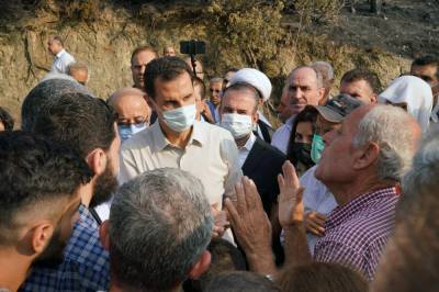 Bashar Assad - Assad makes rare visit to areas hit by fires in west Syria - clickorlando.com - Syria - city Sana - city Beirut