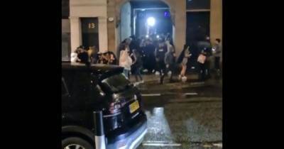 Huge crowd of club revellers hug and dance in street at 10pm in Covid-hit city - dailystar.co.uk