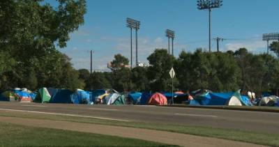Adam Laughlin - No end date set for Rossdale homeless encampment as Edmonton moves forward with convention centre housing plans - globalnews.ca - city Interim