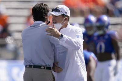 Les Miles - Kansas coach cleared of virus but skips West Virginia game - clickorlando.com - state West Virginia - state Kansas - county Lawrence