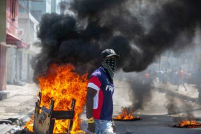 Jovenel Moise - Haitian police, protesters clash; president calls for unity - clickorlando.com - Haiti - city Port-Au-Prince
