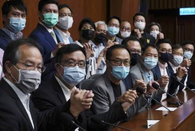 Hong Kong disqualifies 4 pro-democracy legislators - clickorlando.com - China - city Beijing - Hong Kong - city Hong Kong