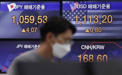 Asian shares mostly drop on worries over surging virus cases - clickorlando.com - city Tokyo