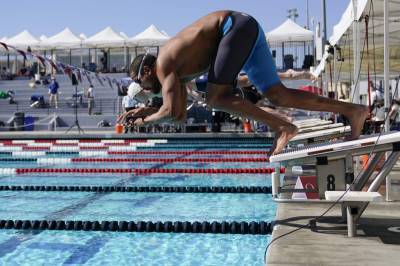 With COVID-19 surging, swimmers return to racing in the US - clickorlando.com - Usa - state Michigan - city Irvine