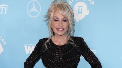 Dolly Parton - Good News - Dolly Parton Reacts to News That Her $1 Million Donation Helped Fund a COVID-19 Vaccine - etonline.com