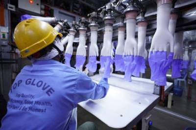 Coronavirus outbreak delays production at world’s top rubber glove maker - clickorlando.com - Malaysia - city Kuala Lumpur