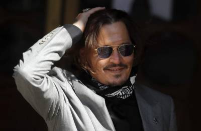 Johnny Depp - Dan Wootton - Amber Heard - Ruling due in Depp's high-stakes libel suit against tabloid - clickorlando.com - Britain