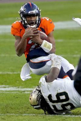 Tom Brady - Hill leads Saints to 31-3 rout of QB-challenged Broncos - clickorlando.com - city New Orleans - county Kendall