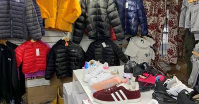 'Counterfeit clothes shop' in Strangeways with 'no Covid safety measures' shut down following raid - two men have been arrested on suspicion of immigration offences - manchestereveningnews.co.uk - city Manchester