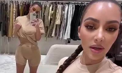 Kim Kardashian - Kim Kardashian models an oversized tee and a pair of boxers from her SKIMS unisex collection - dailymail.co.uk
