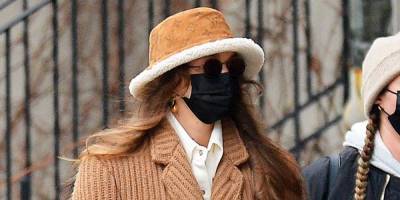 Louis Vuitton - Gigi Hadid Looks Chic in a Louis Vuitton Bucket Hat for a Shopping Trip with Her Baby Daughter - harpersbazaar.com - New York