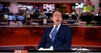 BBC news anchor startled as camera cuts to him slouched and yawning in epic live gaffe - mirror.co.uk