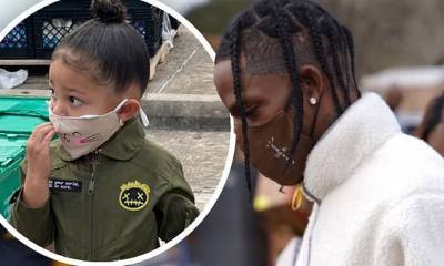 Travis Scott - Stormi Webster - Travis Scott hands out toys and food in his hometown of Houston with daughter Stormi's help - dailymail.co.uk - state Texas - Houston, state Texas