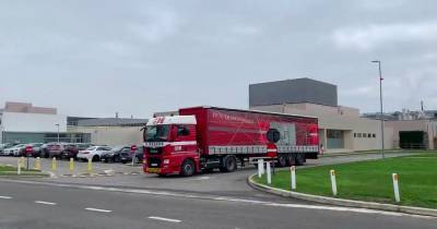 Lorries loaded with Pfizer Covid vaccine leave factory for UK in historic moment - dailystar.co.uk
