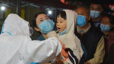 China tests 250,000 people for Covid after new cluster emerges - rte.ie - China